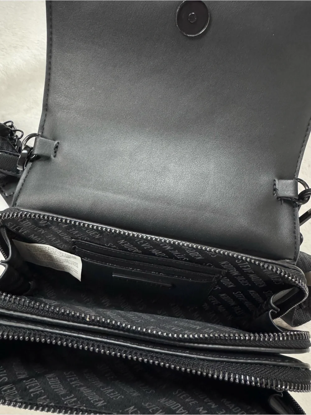 Steve Madden Black Embossed Logo Crossbody Bag.